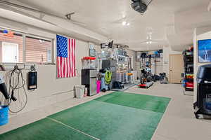 Workout room featuring concrete floors
