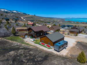 Aerial perspective of suburban area featuring a water and mountain view