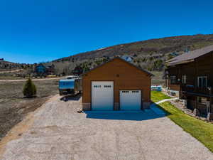Detached garage featuring a mountain view