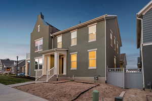 View of front of home with a residential view and stucco siding
