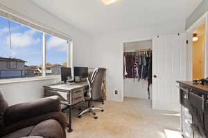 Office space featuring light colored carpet