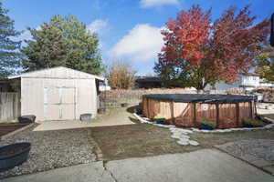 View of shed featuring a fenced backyard