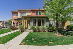 View of front facade with a porch and a front yard
