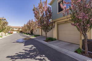 View of front of property with stucco siding and a residential view