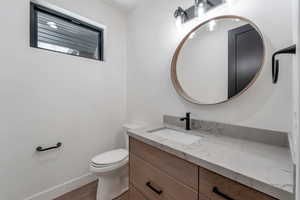 Bathroom featuring vanity and light wood-style floors