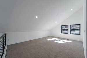 Bonus room with vaulted ceiling, carpet floors, and recessed lighting