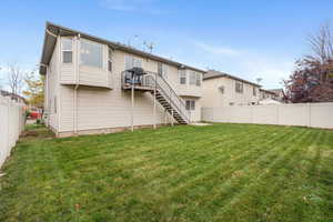 Rear view of property with stairway