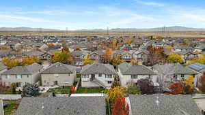 Aerial perspective of suburban area featuring a mountain backdrop
