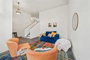 Living area featuring stairway and wood finished floors
