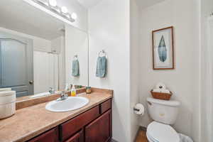 Full bathroom with a shower with shower curtain, vanity, and light tile patterned floors