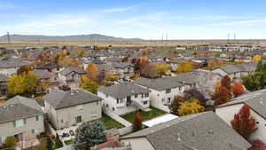 Aerial view of residential area featuring a mountain backdrop