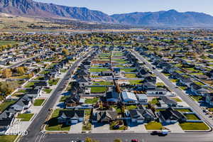 Aerial perspective of suburban area featuring a mountain backdrop
