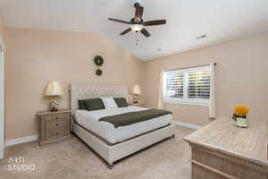 Bedroom featuring light colored carpet, lofted ceiling, and ceiling fan