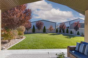 Fenced backyard with a patio area