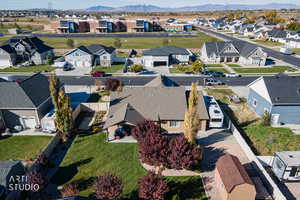 Aerial perspective of suburban area with a mountain backdrop