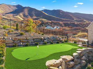 putting green with view of mountains