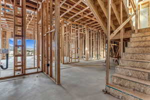 Misc room featuring unfinished concrete flooring
