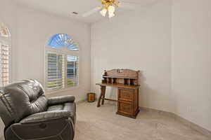 Bedroom featuring ceiling fan and light tile patterned flooring and Wall Bed