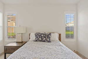 Bedroom with multiple windows