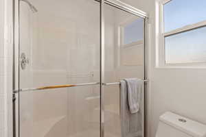 Primary bathroom with a shower stall