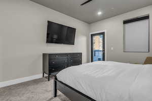 Bedroom with light carpet, access to outside, recessed lighting, and a ceiling fan