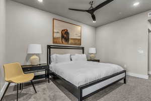 Carpeted bedroom with recessed lighting and a ceiling fan