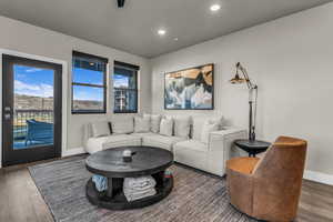 Living room featuring wood finished floors and recessed lighting