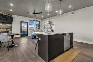 Kitchen featuring modern cabinets, pendant lighting, dark wood finished floors, recessed lighting, and a ceiling fan