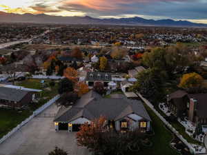 Aerial overview of property's location with nearby suburban area and a mountain backdrop