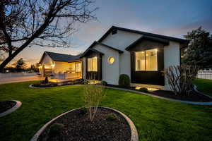 View of front of property with brick siding and a garage