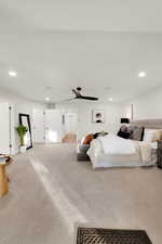 Carpeted bedroom with recessed lighting and a ceiling fan