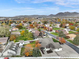 Aerial perspective of suburban area featuring a mountainous background