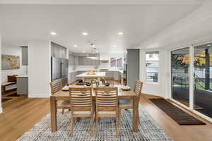 Dining area with recessed lighting and light wood finished floors
