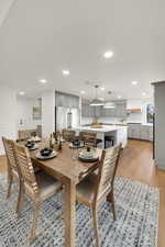 Dining space featuring light wood-style flooring and recessed lighting