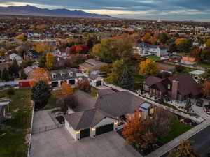 View of property location featuring nearby suburban area and a mountain backdrop