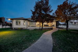 View of front of home featuring a deck and brick siding