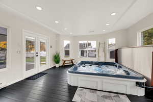 Playroom with a jacuzzi, dark wood-style floors, and recessed lighting