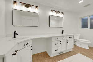 Full bath featuring double vanity and recessed lighting