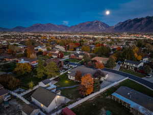 Aerial perspective of suburban area featuring a mountain backdrop