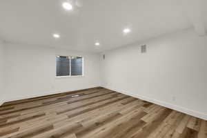 Spare room featuring recessed lighting and light wood-style flooring