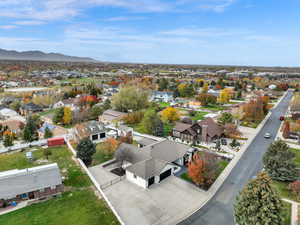 Aerial perspective of suburban area with a mountainous background