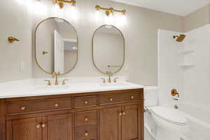 Bathroom with double vanity and  shower combination