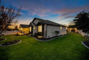 Property exterior at dusk featuring brick siding