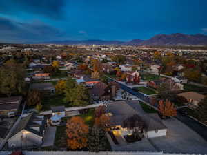 Aerial perspective of suburban area with a mountainous background