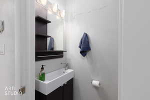 Half bathroom featuring vanity