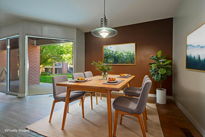 Dining room featuring wood finished floors and baseboards