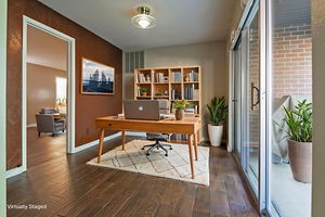 Office featuring dark wood-style floors