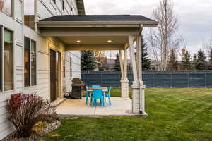 Fenced backyard with grilling area