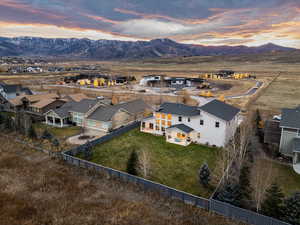 Aerial view at dusk of a residential view and a mountain view
