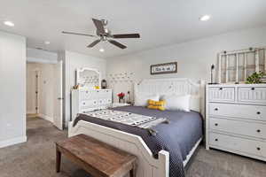 Master bedroom featuring recessed lighting and a ceiling fan